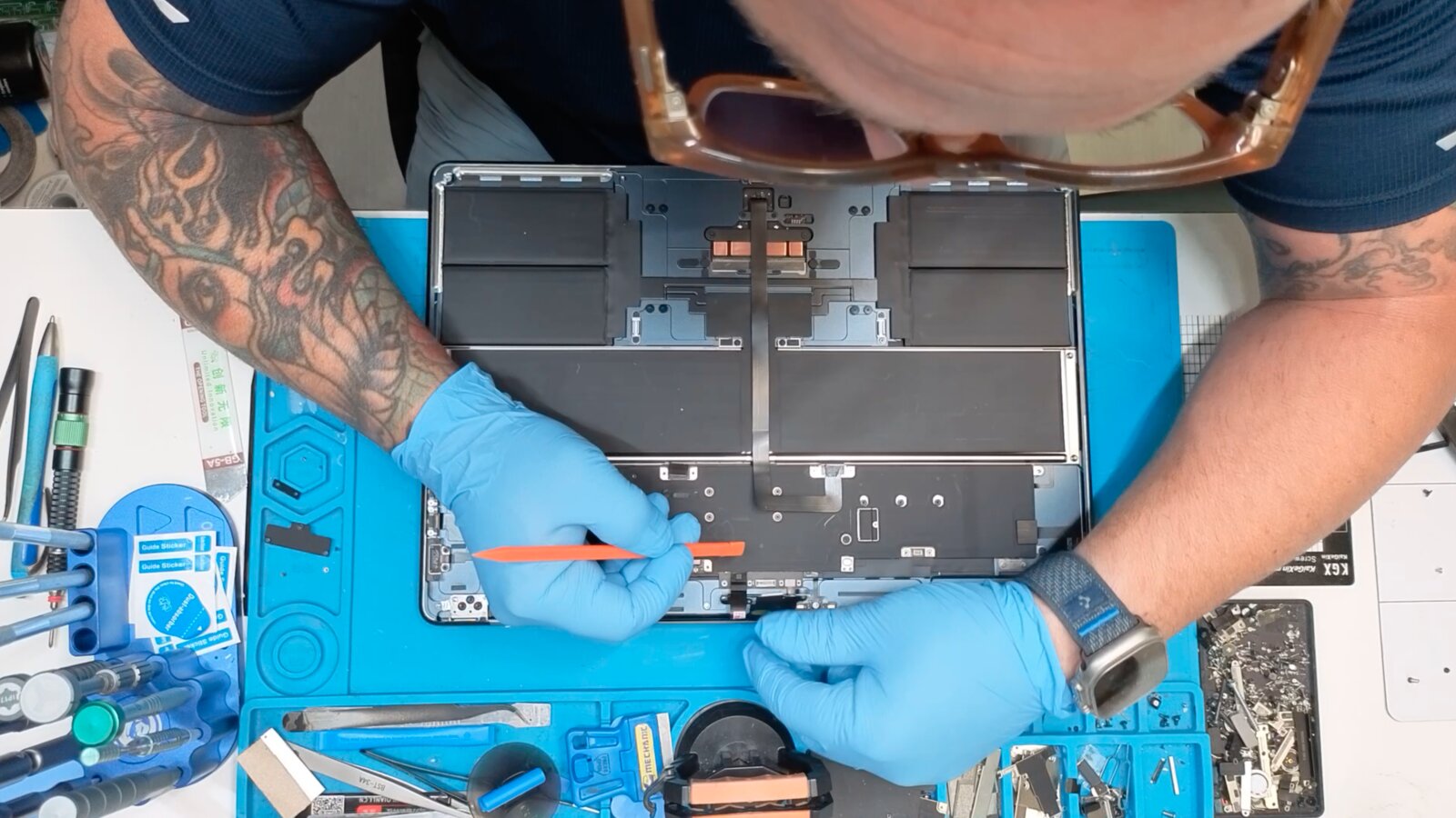 Gregory Mazzola repairing a laptop at the ubrokeit bench in West Los Angeles